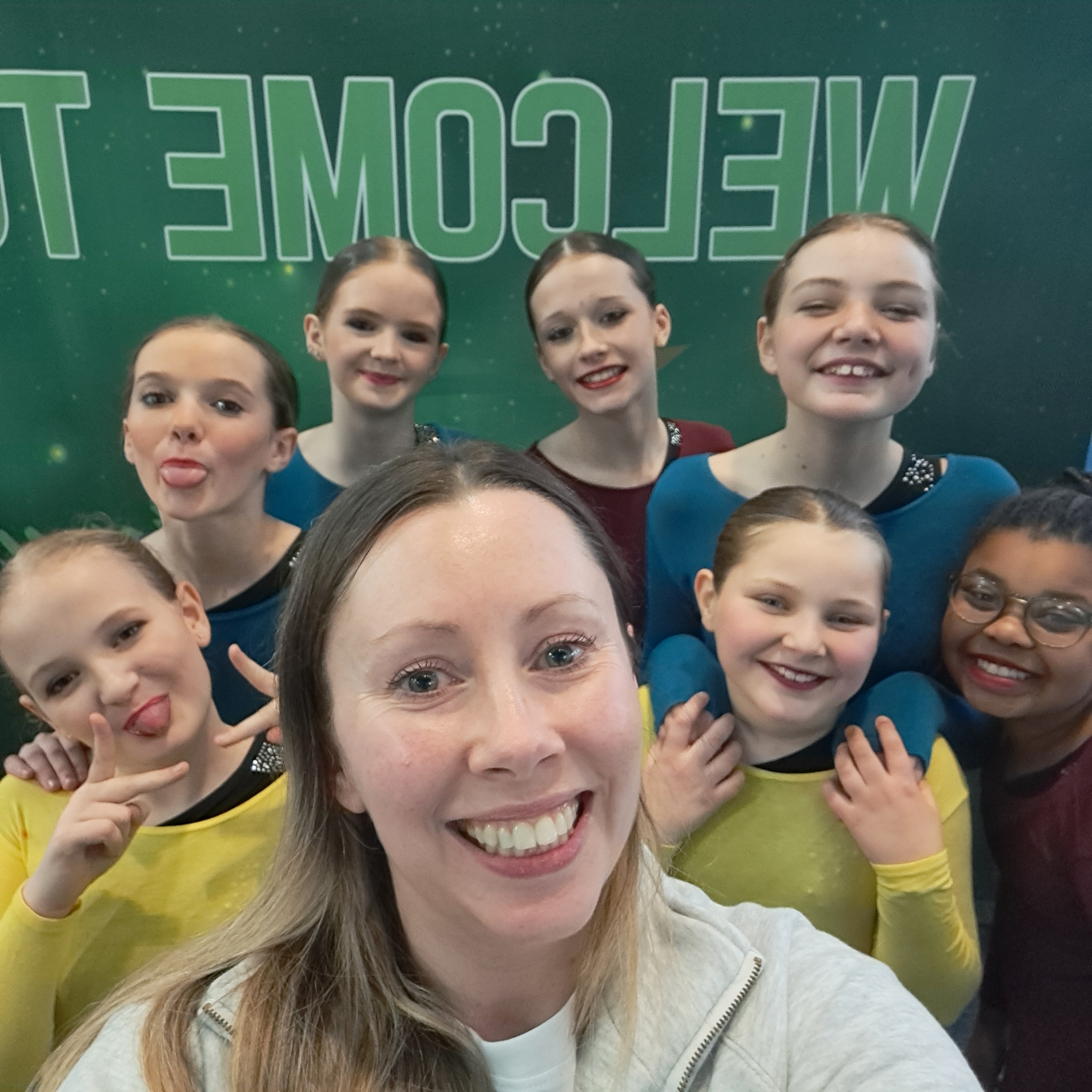 Group selfie with teacher and students at competition